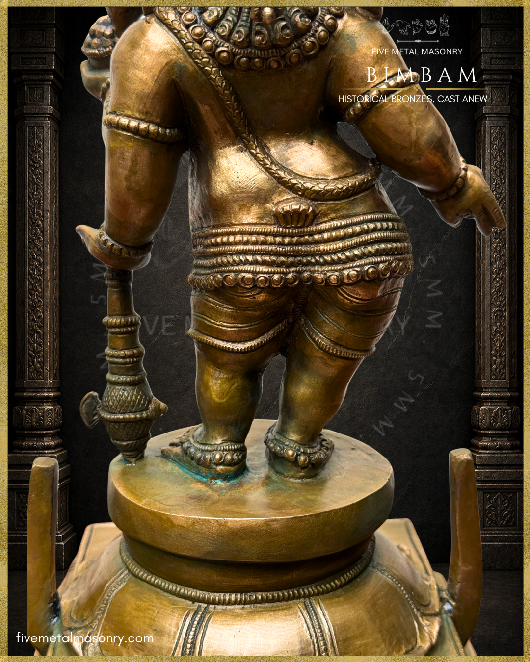 Three-quarter rear close-up view of the BIMBAM Thiruvanaikaval Ganesha in handcrafted Panchaloha, highlighting the ornamented kati-bandha with pendent bells, drapery and leg ornaments, anklets, and the long-handled ankusa resting on the pedestal.