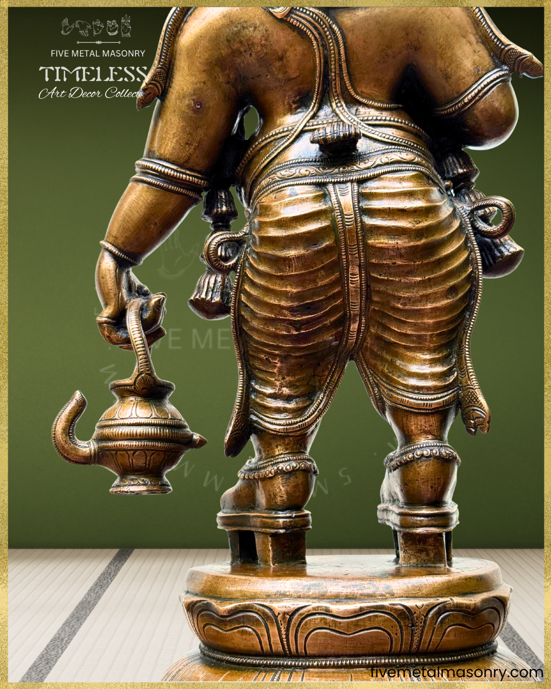 Rear close-up of antique finish Panchaloha bronze Ganesha highlighting pleated lower garment, kamandalu, anklets, lotus pedestal and finely detailed South Indian sculptural craftsmanship from the Timeless collection.