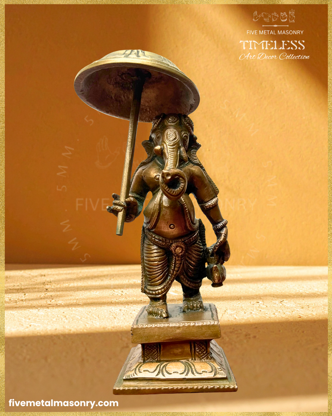Front view of Handcrafted Panchaloha bronze Umbrella Ganesha (Mapillai Ganesha) in a walking posture, holding a ceremonial umbrella and water pot, from the Timeless collection, rooted in silpa-sastra tradition.