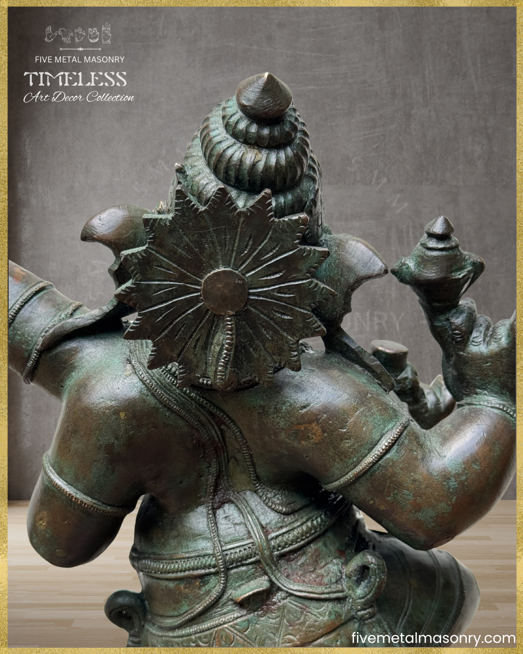 Rear close-up of a handcrafted Panchaloha bronze Nritta Ganesha from the TIMELESS Collection, highlighting the Karanda Makuta, Siras Chakra, flowing garment ties, traditional ornamentation, and antique patina finish.