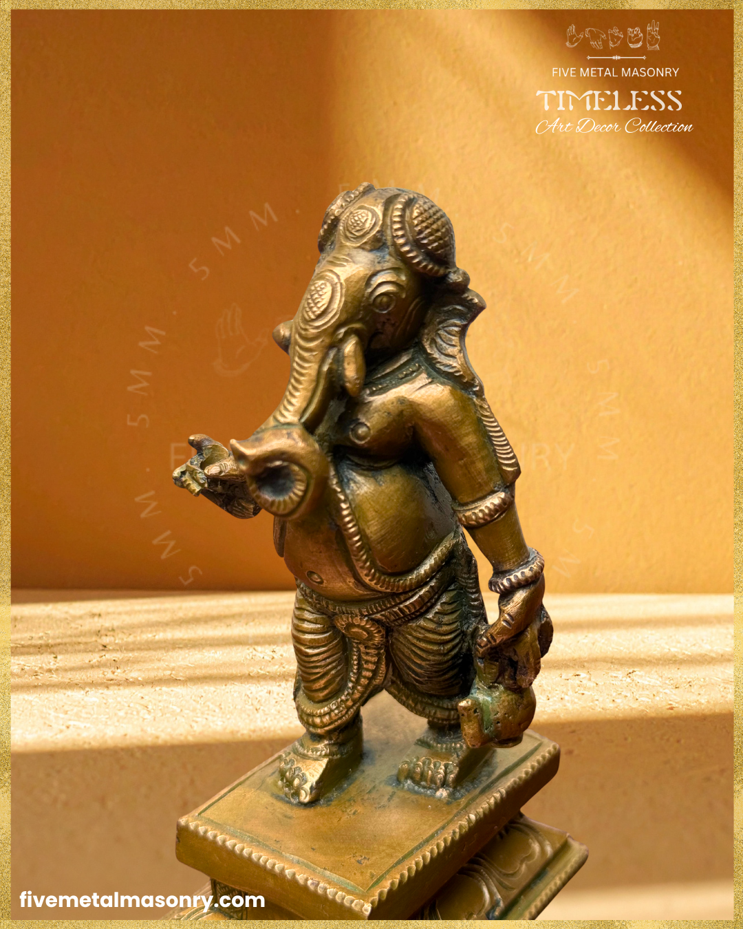 Close-up angled view of handcrafted Panchaloha bronze Umbrella Ganesha (Mapillai Ganesha) in a walking posture, highlighting the curled trunk, facial details, ornaments and water pot, from the Timeless collection, rooted in silpa-sastra tradition.
