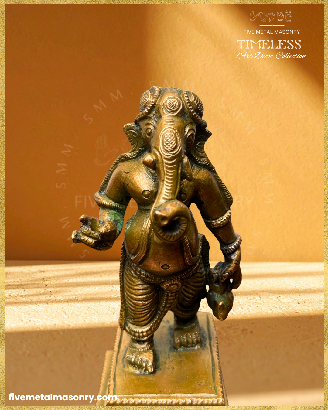 Close-up front view of handcrafted Panchaloha bronze Umbrella Ganesha (Mapillai Ganesha) in a walking posture, highlighting the curled trunk, facial details, ornaments and water pot, from the Timeless collection, rooted in silpa-sastra tradition.