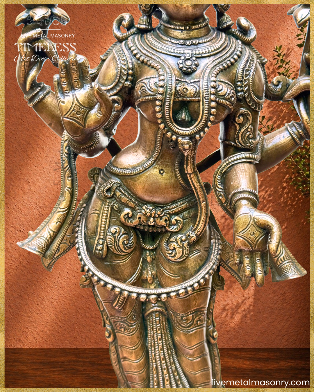 Close-up of Lakshmi panchaloha bronze showing torso, waist , lower hands and ornamentation details