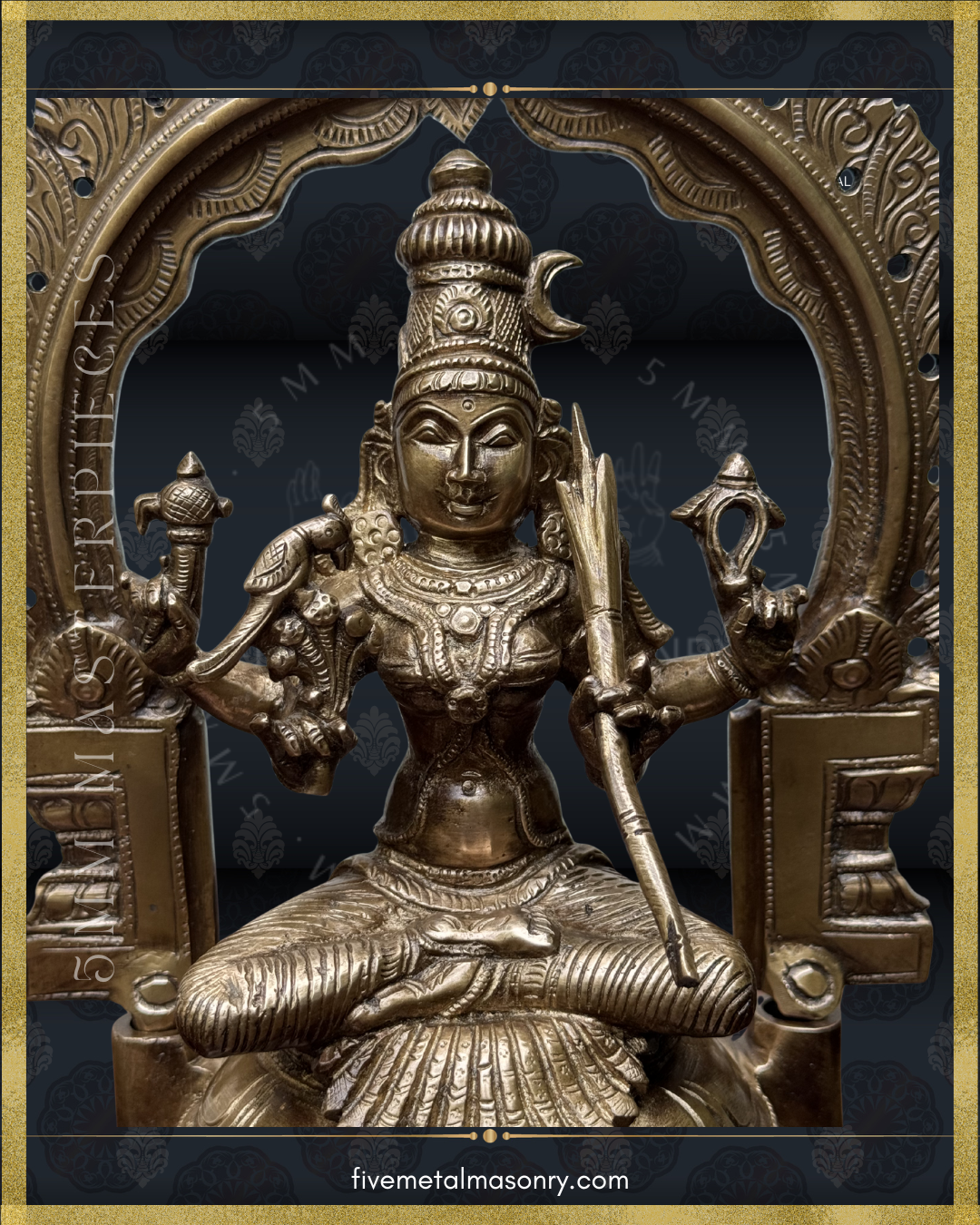 Close-up view of Panchaloha bronze Kamakshi statue showing mukha, karanda makuta, four-armed iconographic form, ornate jewelry and sugarcane bow beneath decorative prabhavali from the Masterpieces collection by Five Metal Masonry.