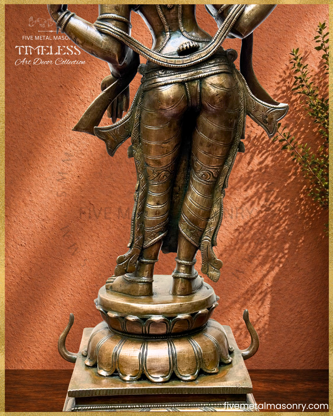 Close-up of Lakshmi panchaloha bronze showing rear side view of lower body, feet, lotus pedestal and intricate ornamentation details
