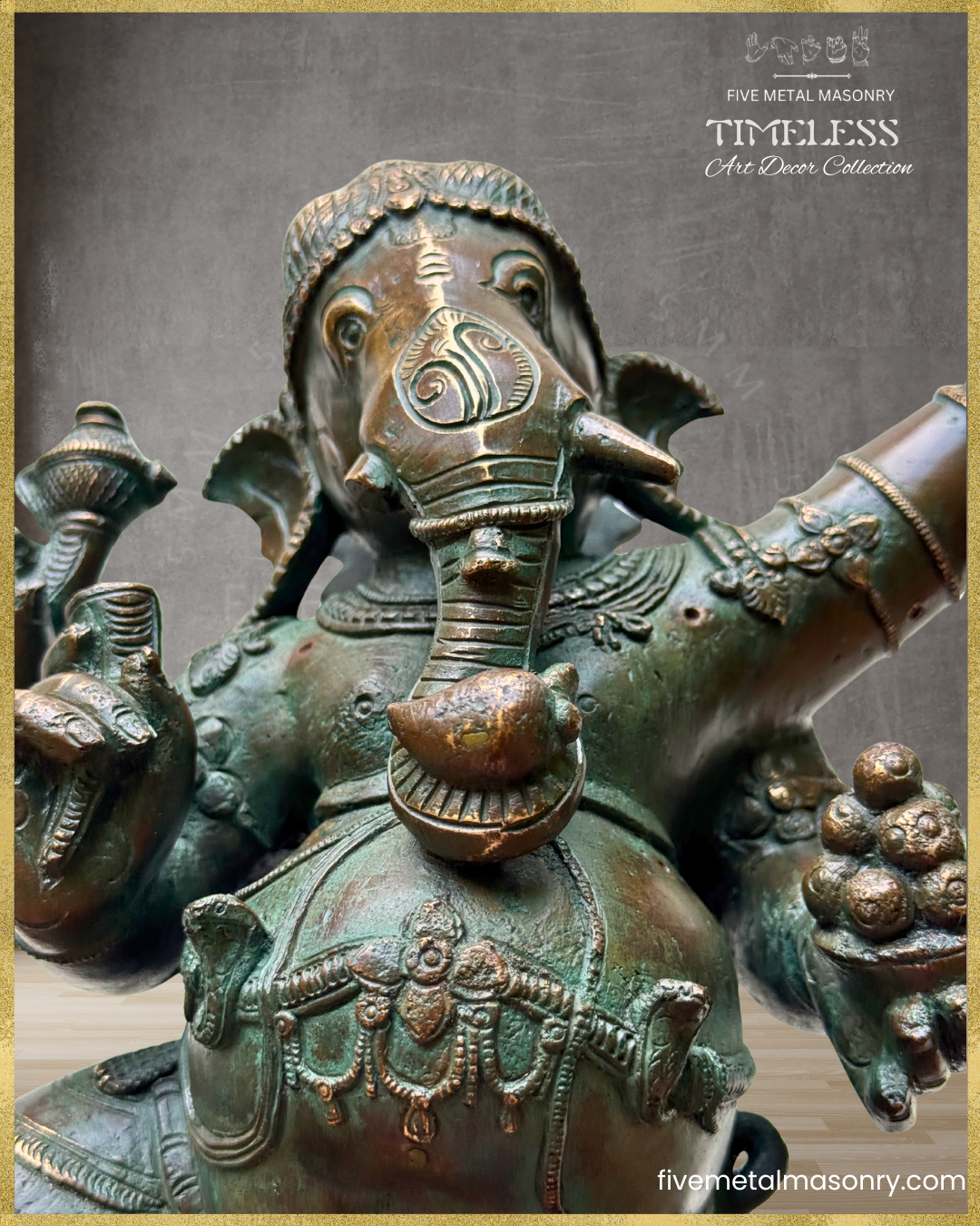 Close-up of a handcrafted Panchaloha bronze Nritta Ganesha from the TIMELESS Collection, highlighting the elephant face, broken tusk, modaka bowl, naga Udarabandha, traditional jewellery, and antique patina finish.