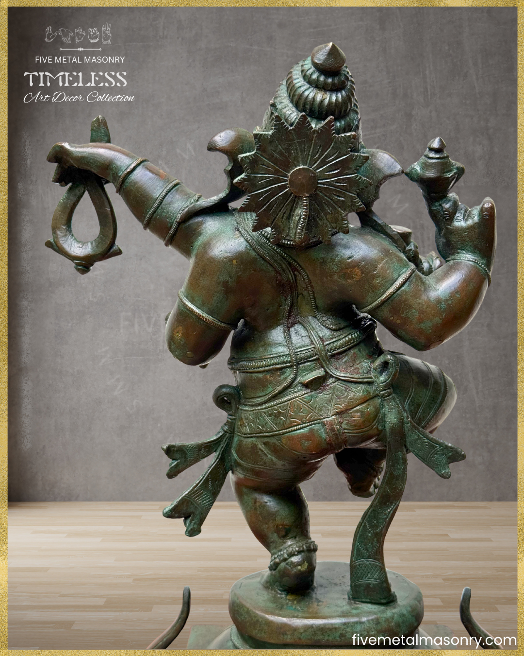 Rear view of a handcrafted Panchaloha bronze Nṛtta Gaṇeśa from the TIMELESS Collection, depicted in a dynamic dancing posture. The image highlights the karaṇḍa-makuṭa, floral siras chakra at the back of the head, flowing garment ties, traditional ornaments, and antique patina finish.