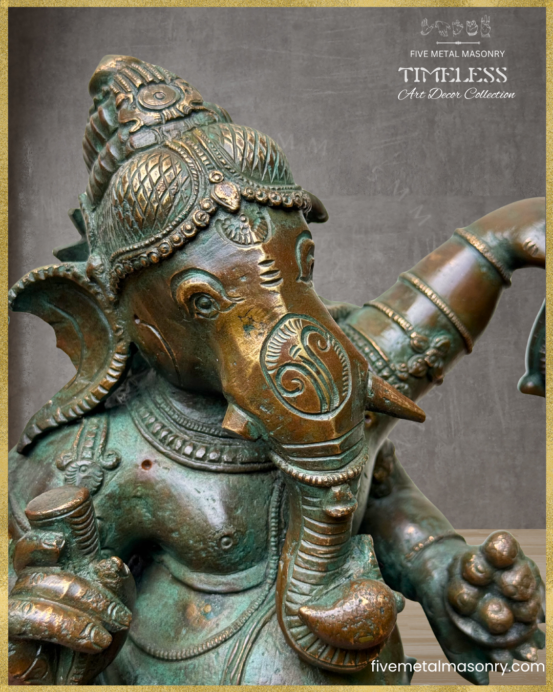 Close-up angled view of a handcrafted Panchaloha bronze Nritta Ganesha from the TIMELESS Collection, highlighting the Karanda Makuta, elephant face, broken tusk, modaka bowl, traditional jewellery, and antique patina finish.