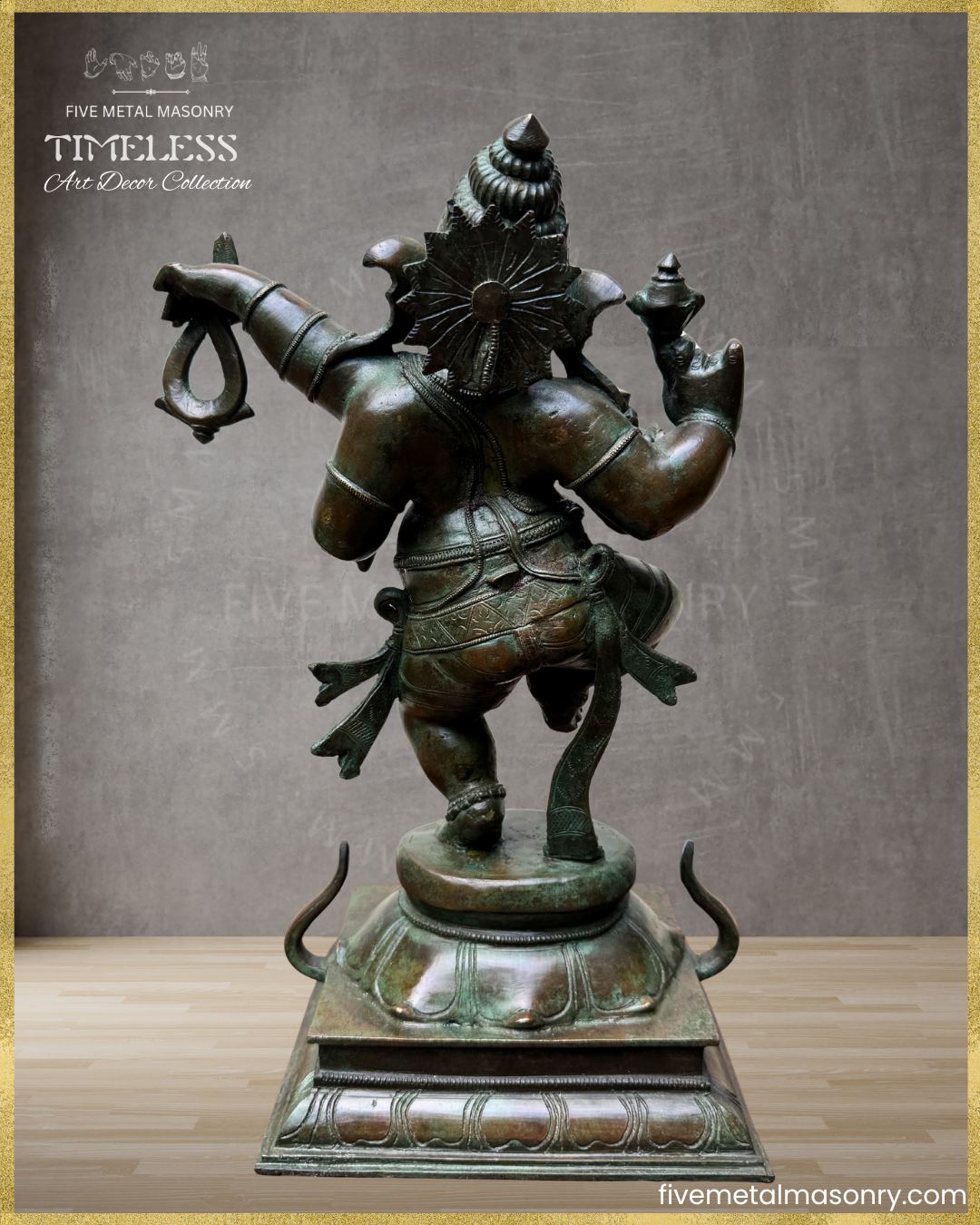 Rear view of handcrafted Panchaloha bronze Nṛtta Dancing Ganesha statue from the TIMELESS Collection, depicted in a dynamic dancing posture with four arms, karanda makuta, lotus pedestal, and antique patina finish.