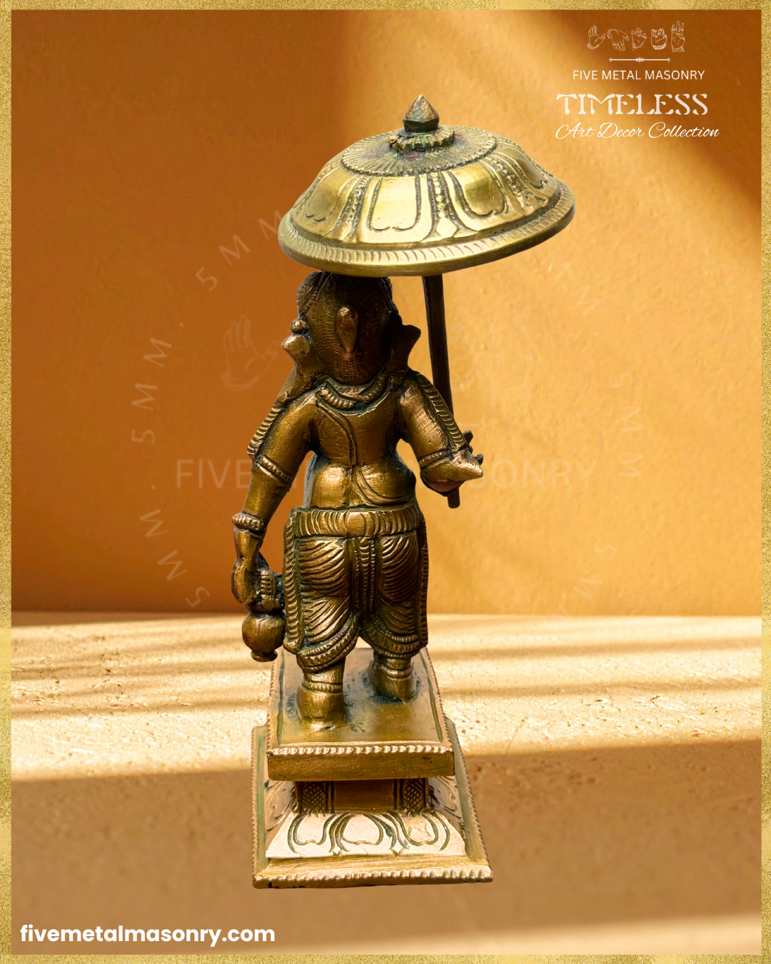 Rear view of handcrafted Panchaloha bronze Umbrella Ganesha (Mapillai Ganesha), showing the small hair tuft at the back of the head, ceremonial umbrella and water pot, from the Timeless collection.
