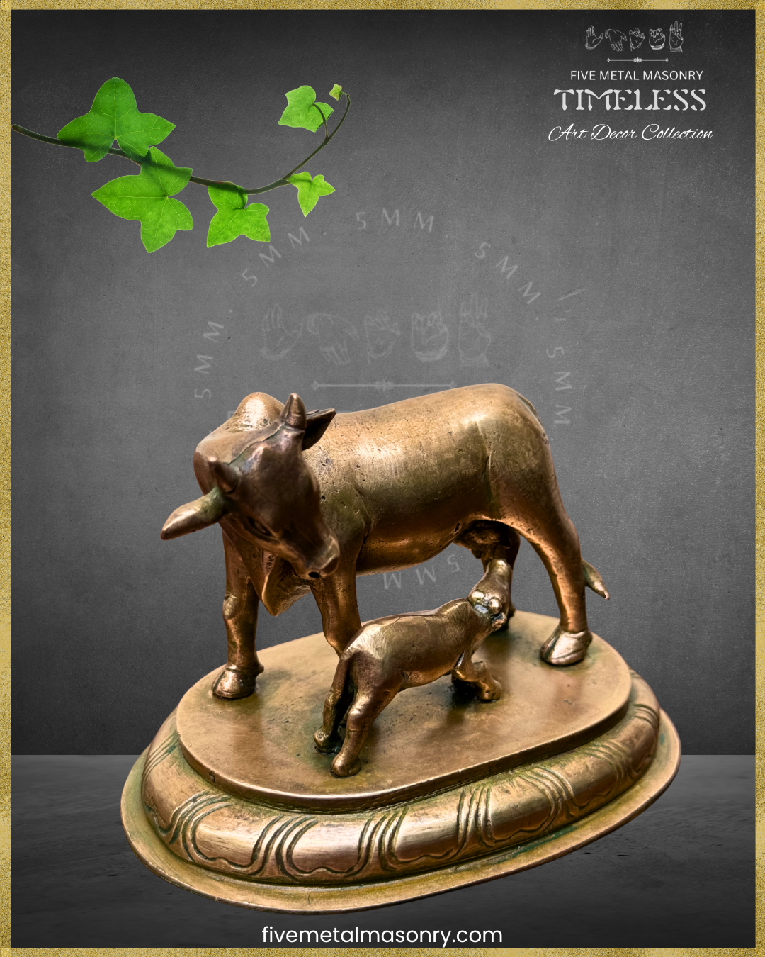 Bronze sculpture of a cow and calf on a decorative base with green leaves above, against a dark background.