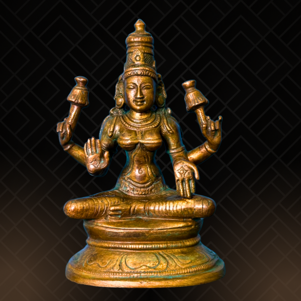 Handcrafted Durga Panchaloha bronze seated in lalitasana on her simha vahana, eight-armed with cakra, khadga, sula, padma, gada, dhanus and sankha, with abhaya mudra, crafted in the South Indian silpa-sastra and traditional iconographic tradition.