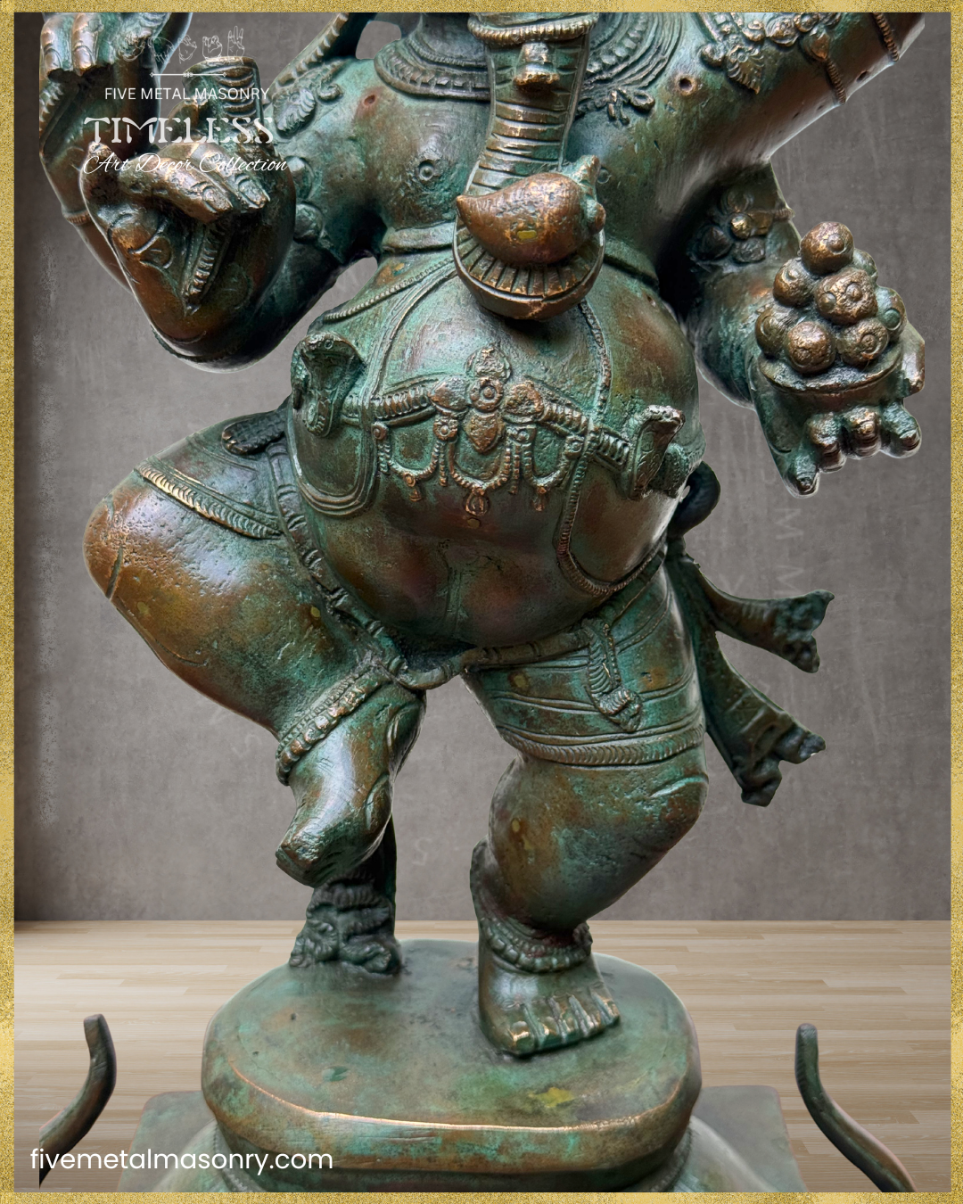 Close-up of a handcrafted Panchaloha bronze Nritta Ganesha from the TIMELESS Collection, highlighting the dancing posture, modaka bowl, broken tusk, waist ornament, traditional jewellery, and antique patina finish.