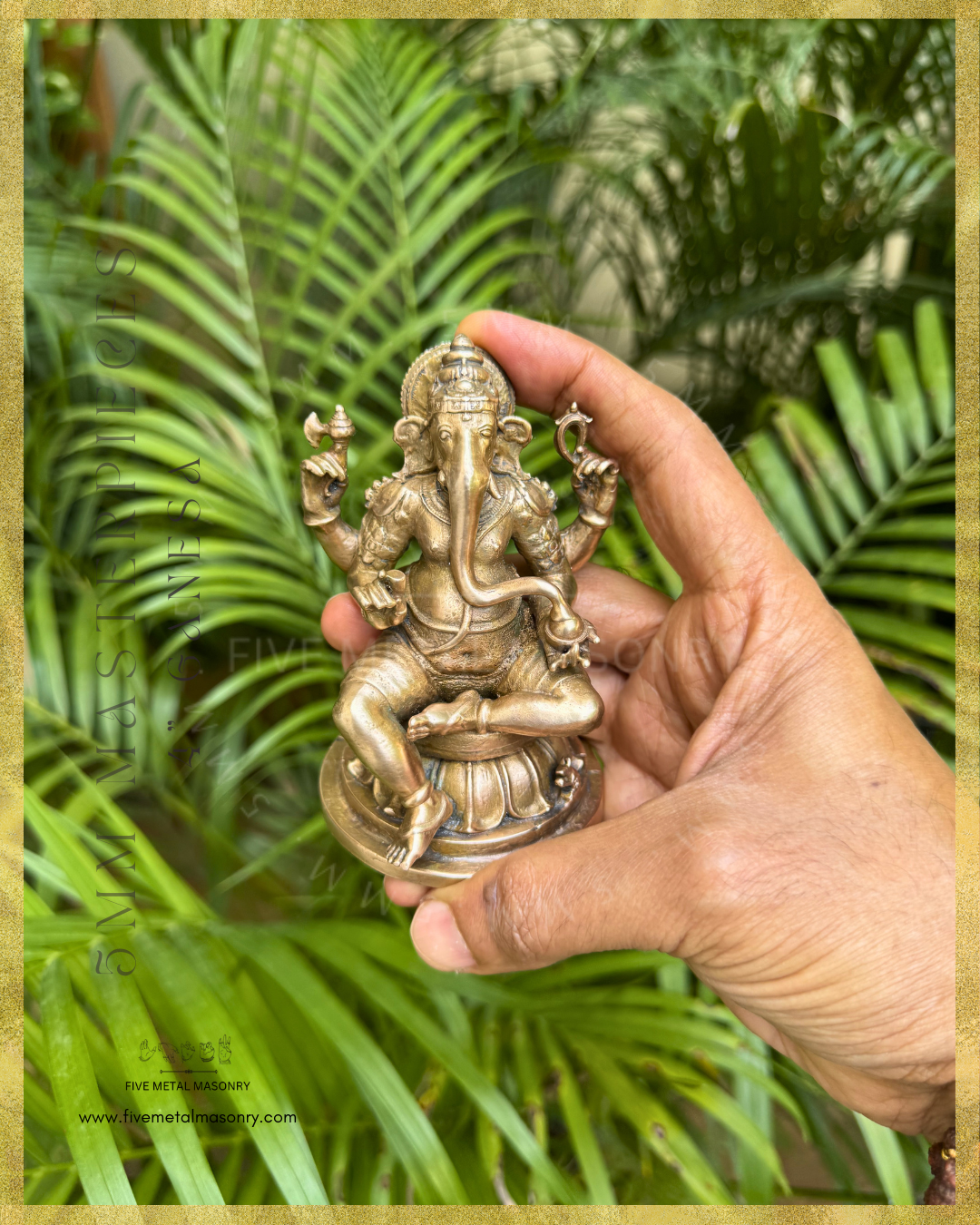 Handheld panchaloha bronze seated Ganesha icon from the Masterpieces collection holding goad, noose, broken tusk and modaka, with elongated curved trunk, karanda makuta, lotus pedestal and mouse vahana in South Indian bronze style.